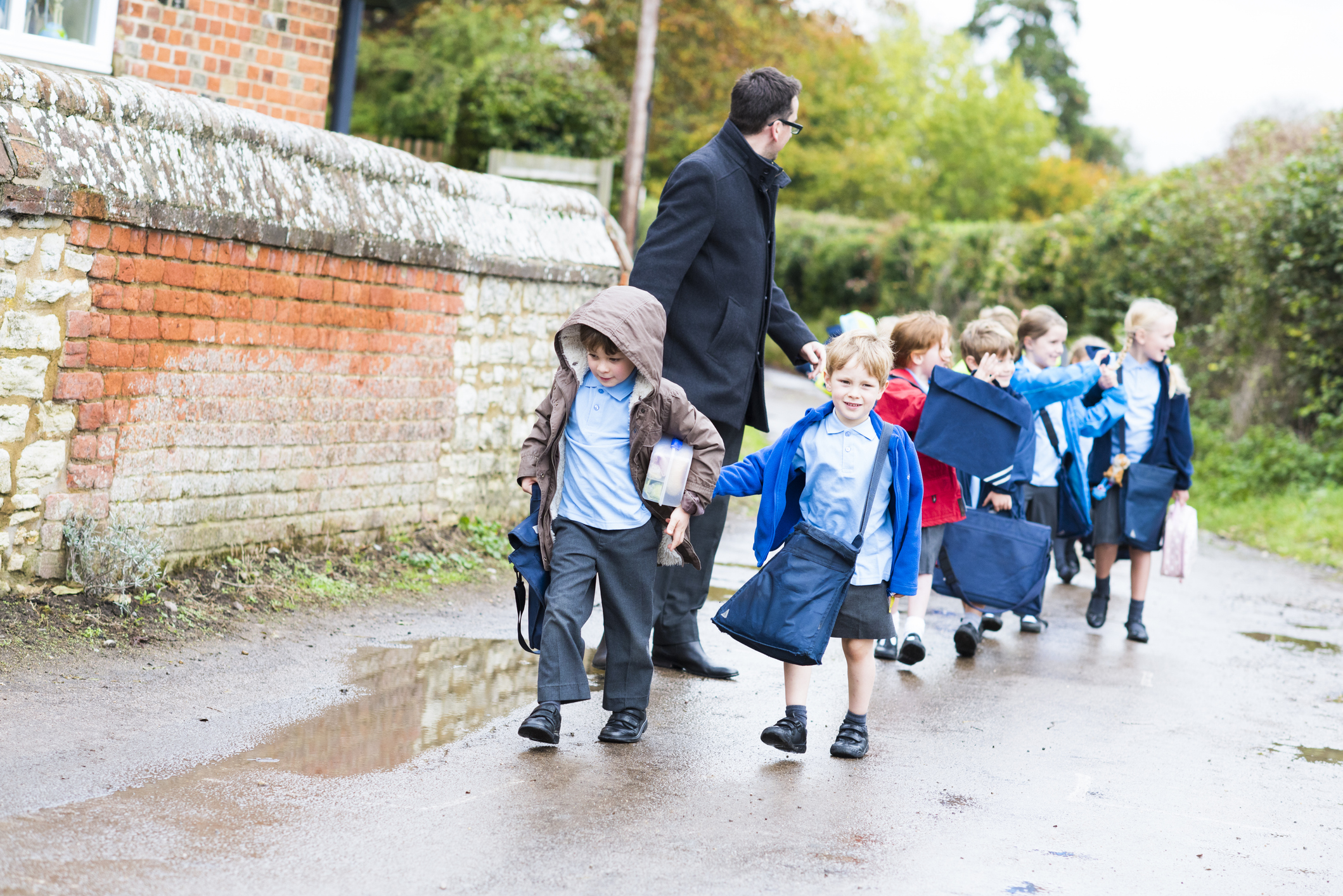 Children leaving school and meeting parents