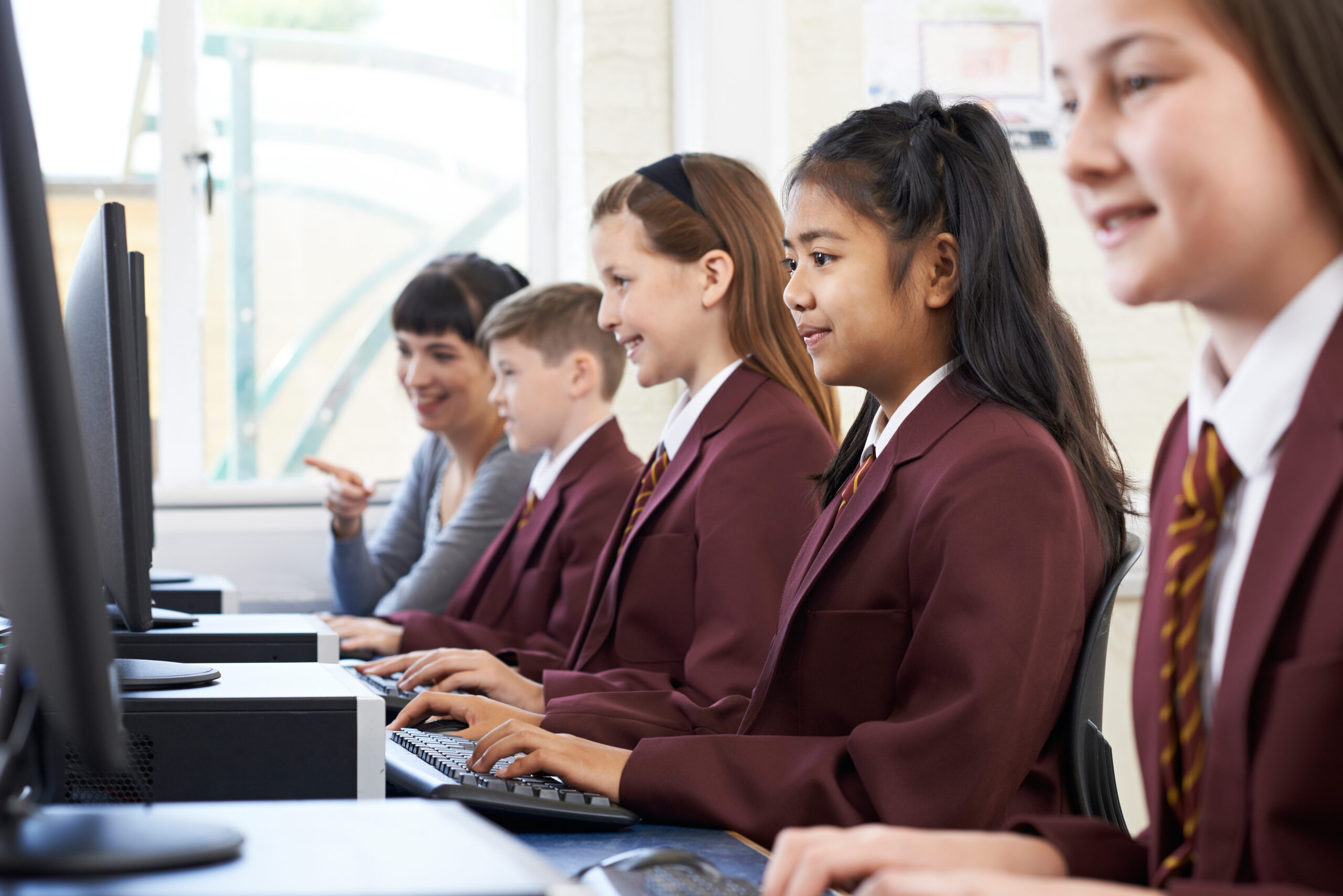 pupils in IT class working at computers